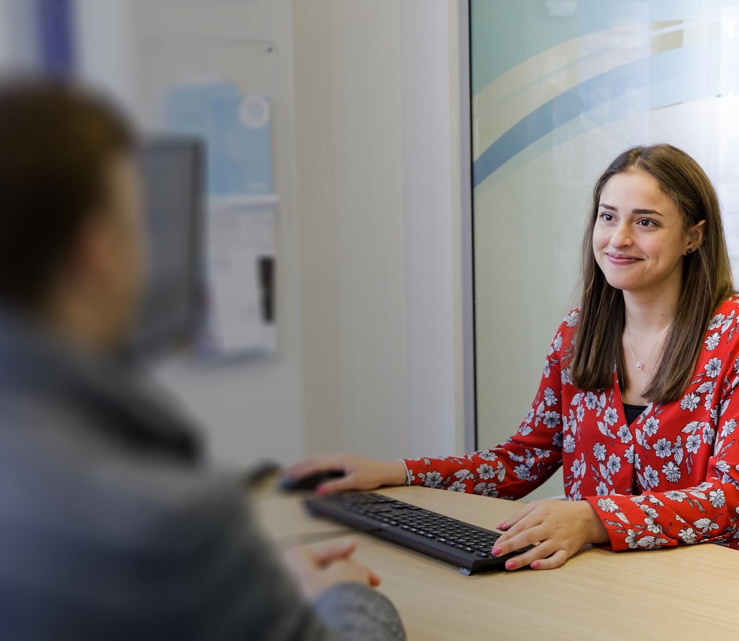 woman at desk with computer